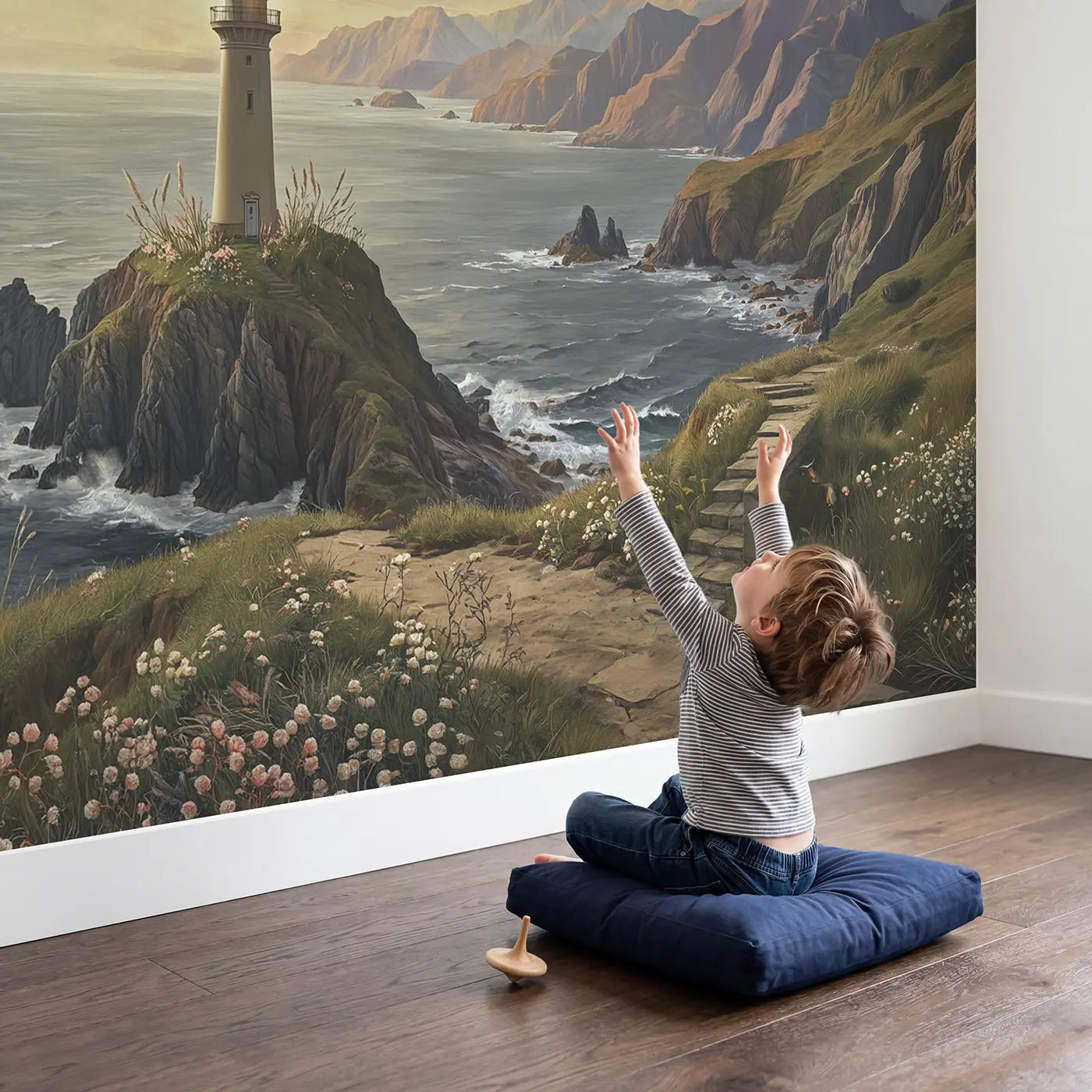 Child in nursery with Cliff Lighthouse Mountain Coast Wallpaper Mural by Whimsy Tots