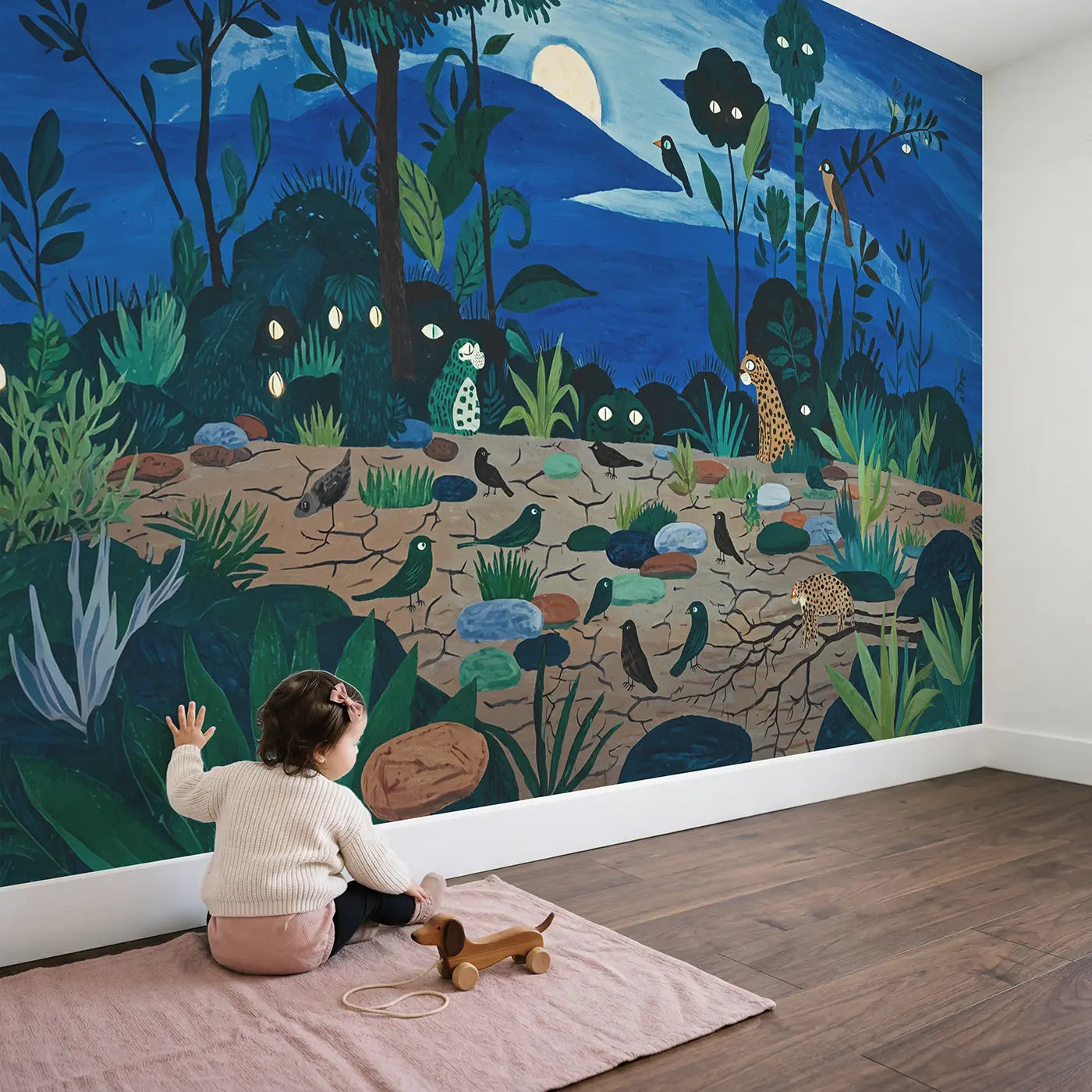 Child in nursery with Nocturnal Safari Scene Eyes Wallpaper Mural by Whimsy Tots