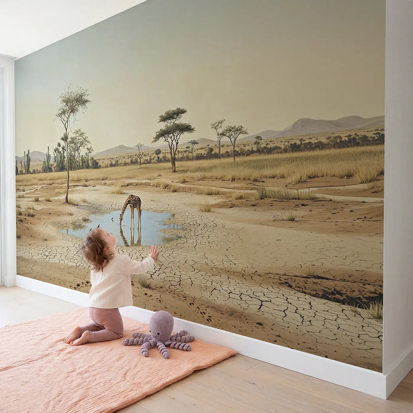 Child in nursery with Savanna Watering Hole Wallpaper Mural by Whimsy Tots
