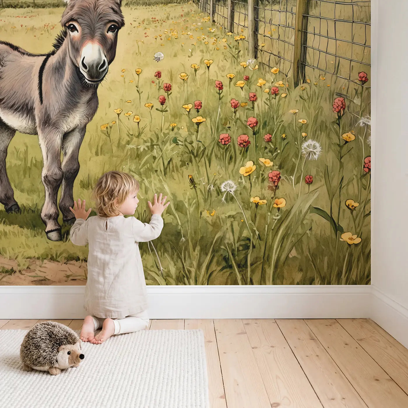 Child in nursery with Fuzzy Donkey Meadow Wallpaper Mural by Whimsy Tots