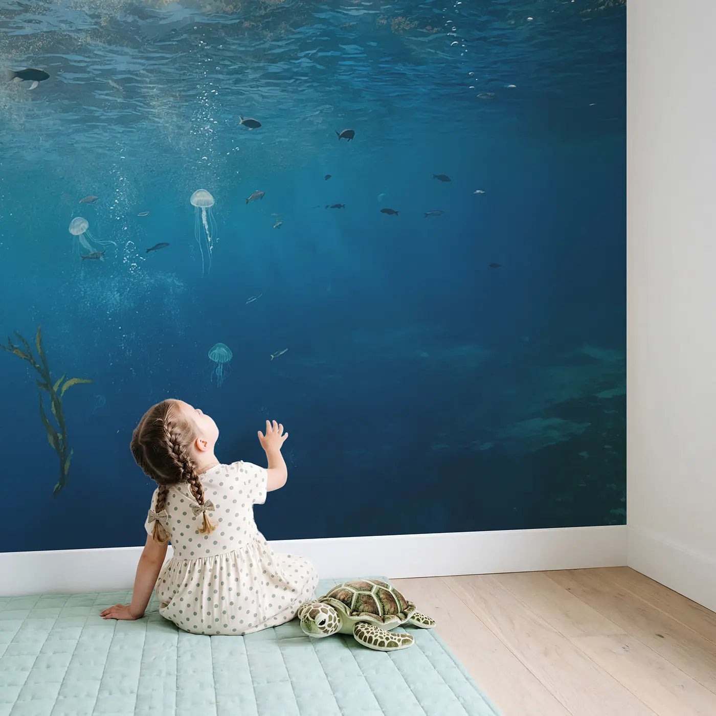 Child in nursery with Underwater Light Dance Wallpaper Mural by Whimsy Tots