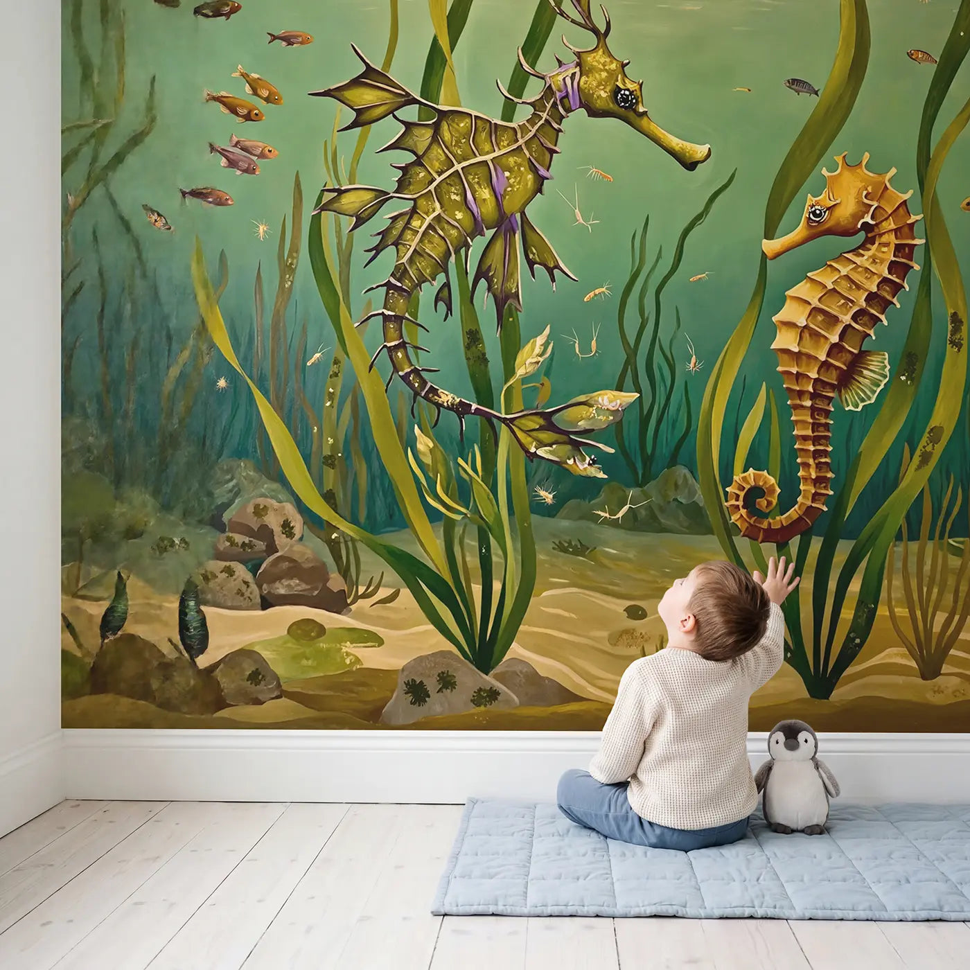 Child in nursery with Sea Dragon and Seahorse Garden Wallpaper Mural by Whimsy Tots