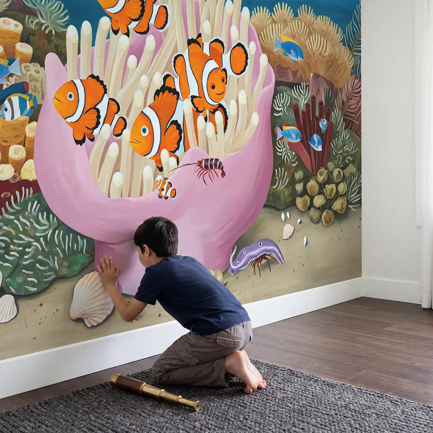 Child in nursery with Clownfish Anemone Home Wallpaper Mural by Whimsy Tots