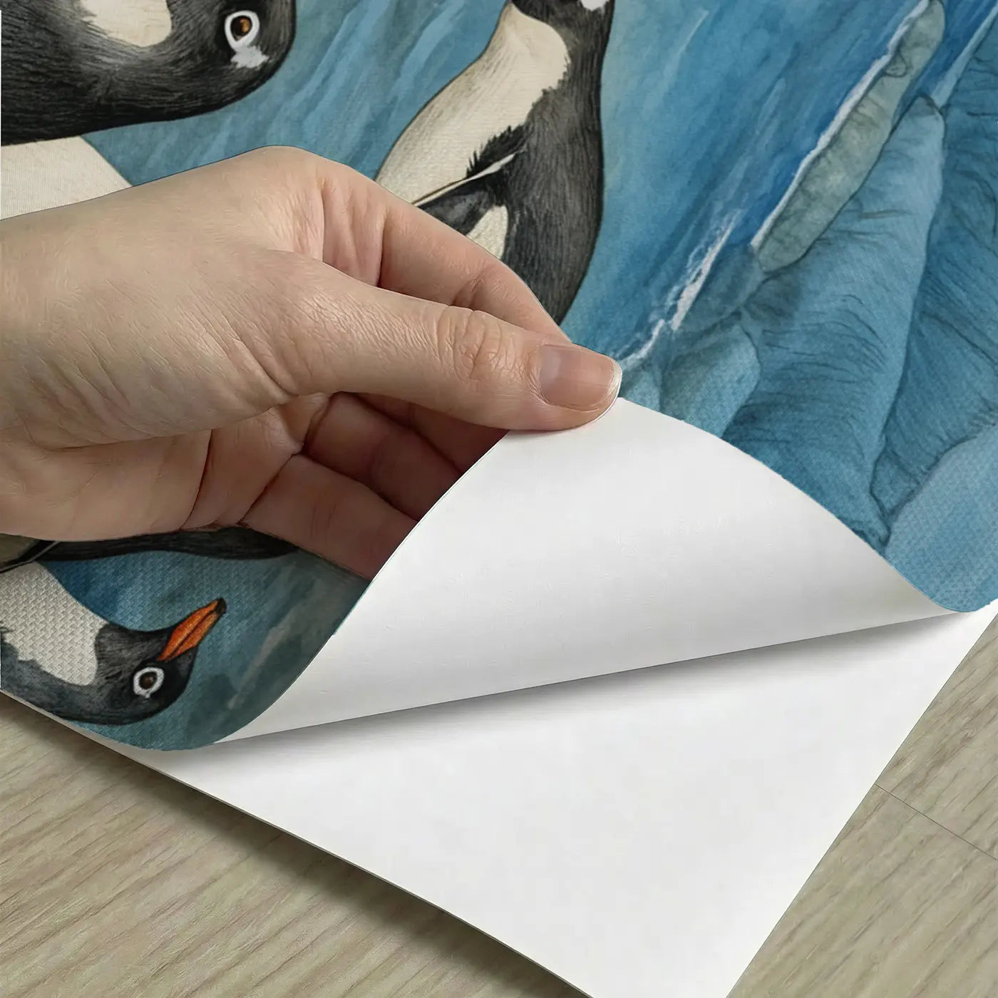 Peel-and-stick detail of Penguin Colony Waters Edge Wallpaper Mural by Whimsy Tots