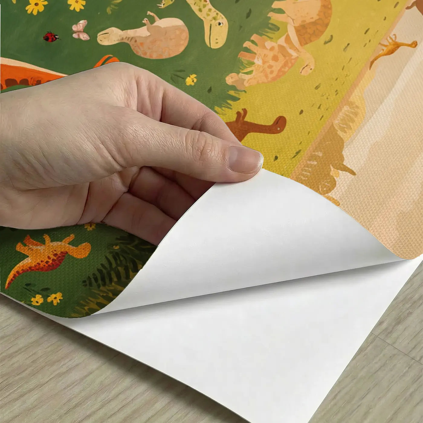 Peel-and-stick detail of Baby Dinosaurs Playing Fern Wallpaper Mural by Whimsy Tots
