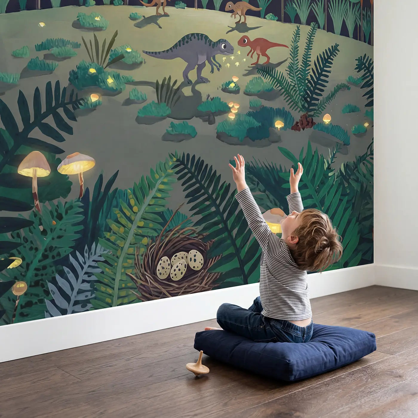 Child in nursery with Moonlit Dinosaur Clearing Wallpaper Mural by Whimsy Tots