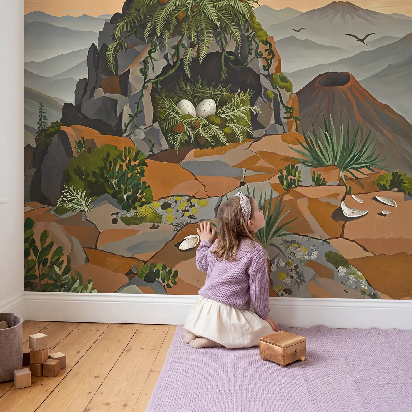 Child in nursery with Pterodactyl Cliff Nest Wallpaper Mural by Whimsy Tots