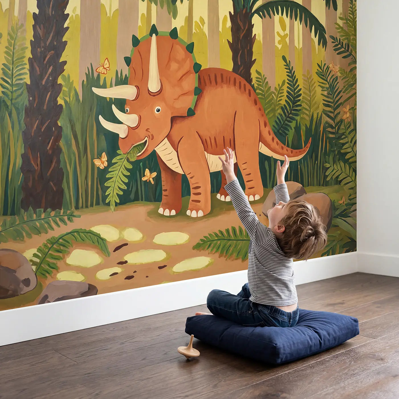 Child in nursery with Friendly Triceratops Fern Forest Wallpaper Mural by Whimsy Tots