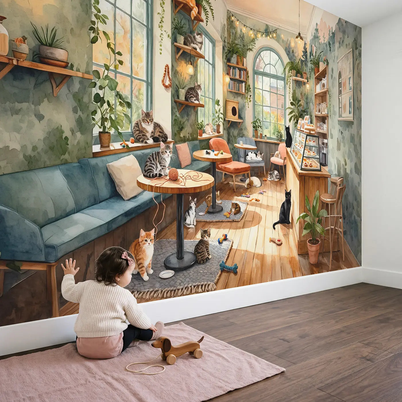 Child in nursery with Cozy Cat Cafe Wallpaper Mural by Whimsy Tots