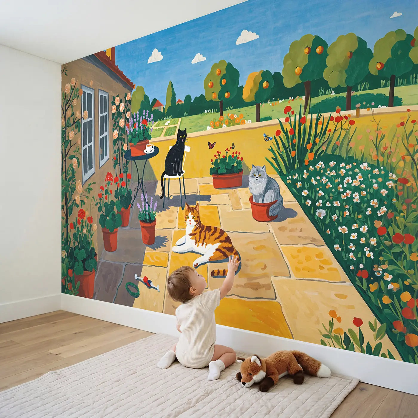 Child in nursery with Garden Cats Sunny Spot Wallpaper Mural by Whimsy Tots