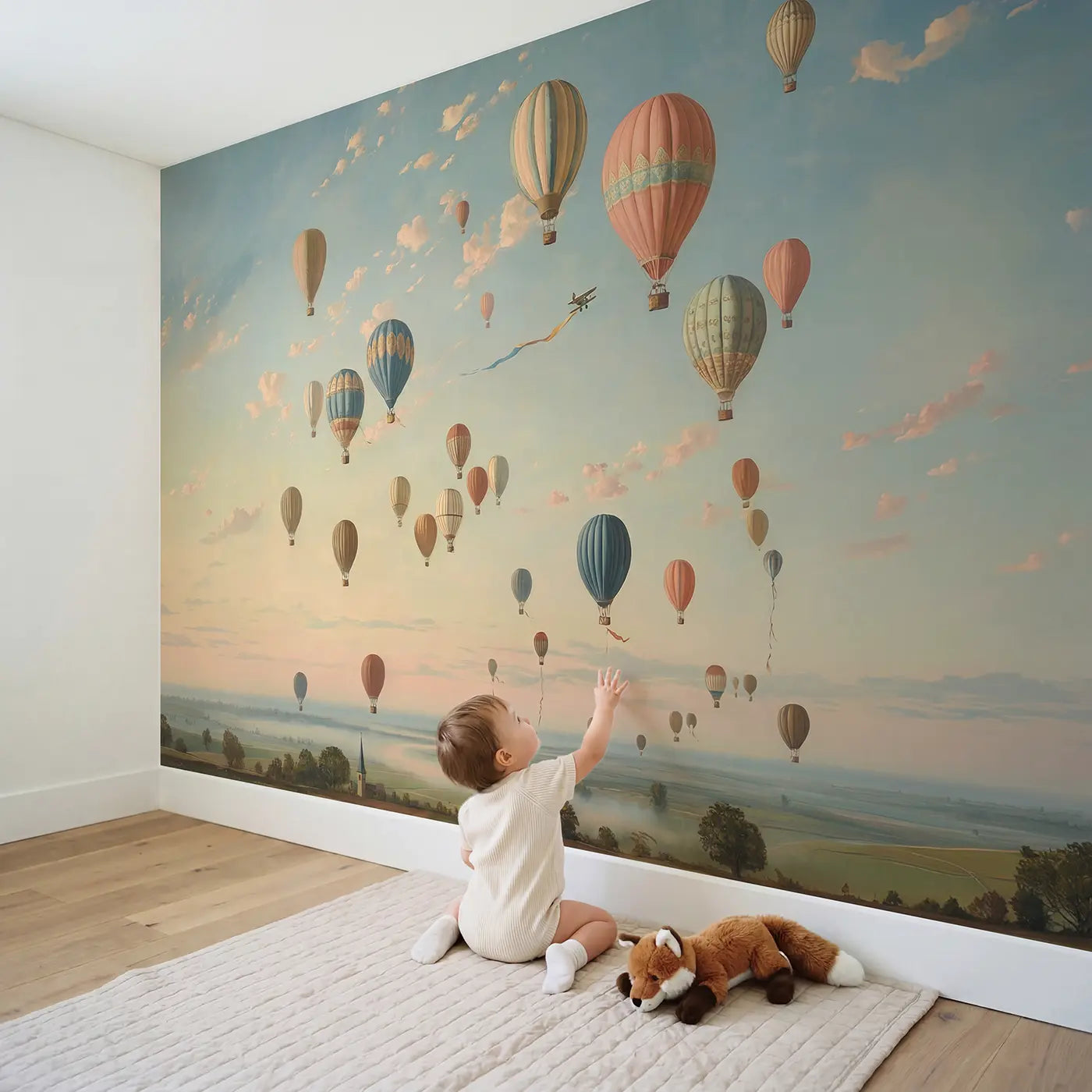 Child in nursery with Sunrise Balloon Festival Wallpaper Mural by Whimsy Tots