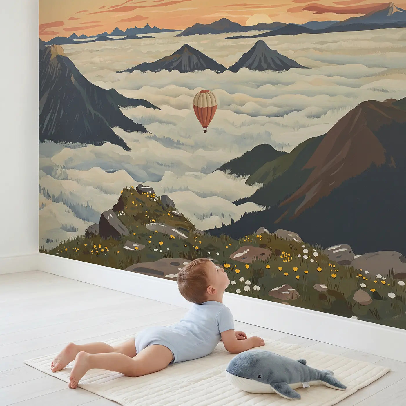 Child in nursery with Mountain Cloud Valley Sunrise Wallpaper Mural by Whimsy Tots