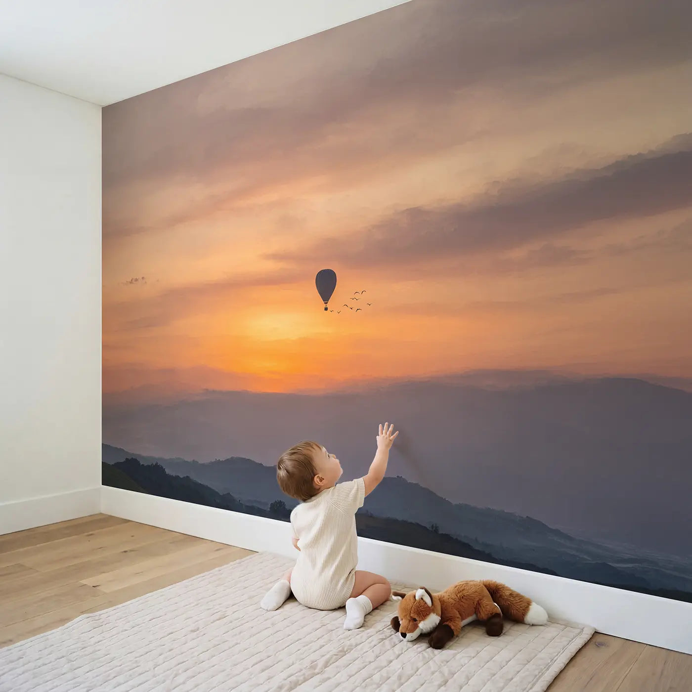Child in nursery with Sunset Sky Balloon Wallpaper Mural by Whimsy Tots