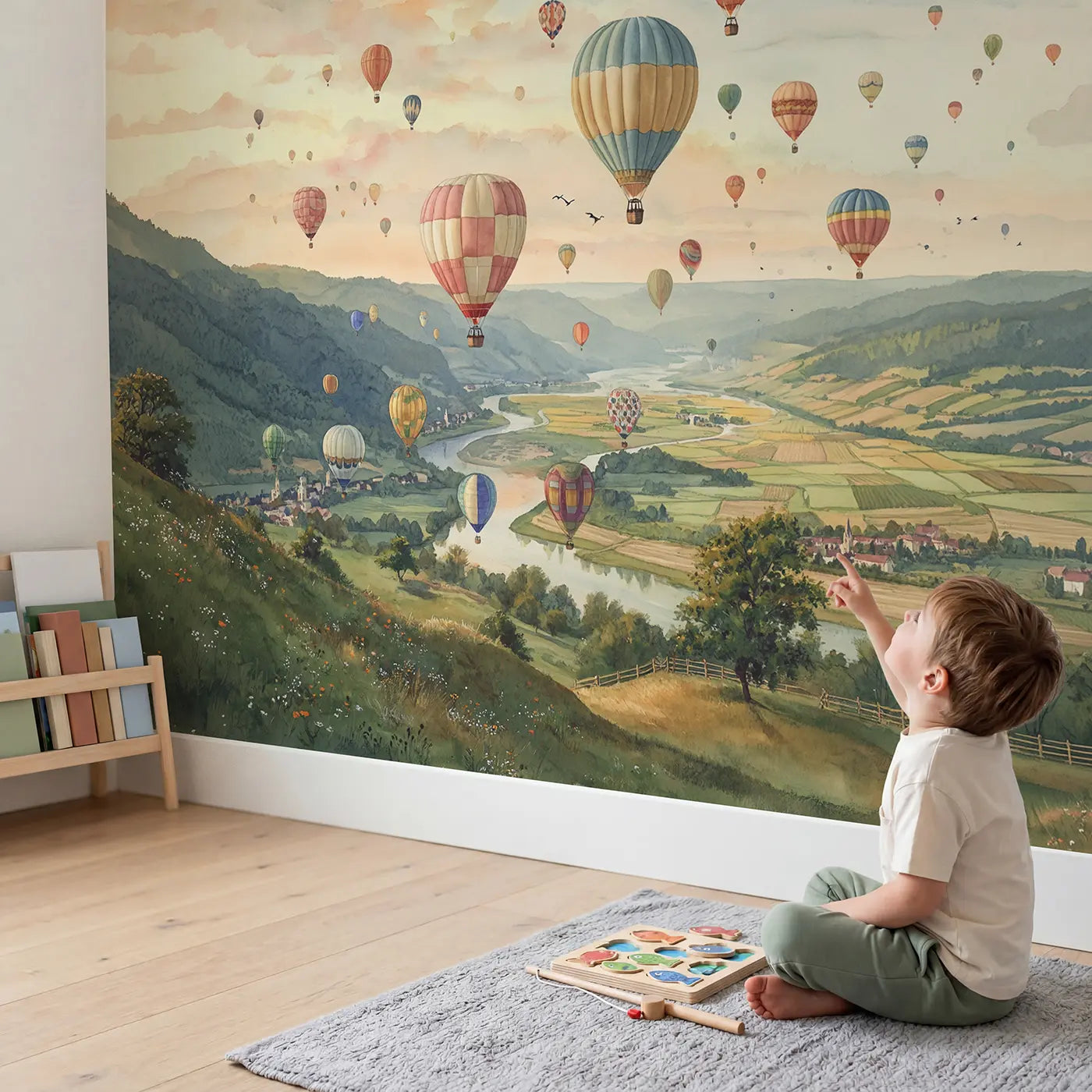Child in nursery with Valley Balloon Festival Wallpaper Mural by Whimsy Tots