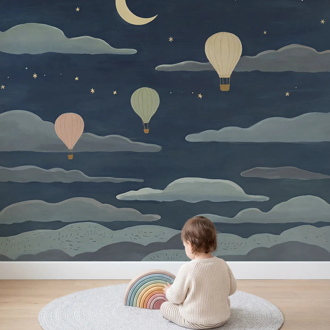 Child in nursery with Midnight Cloud Balloon Wallpaper Mural by Whimsy Tots