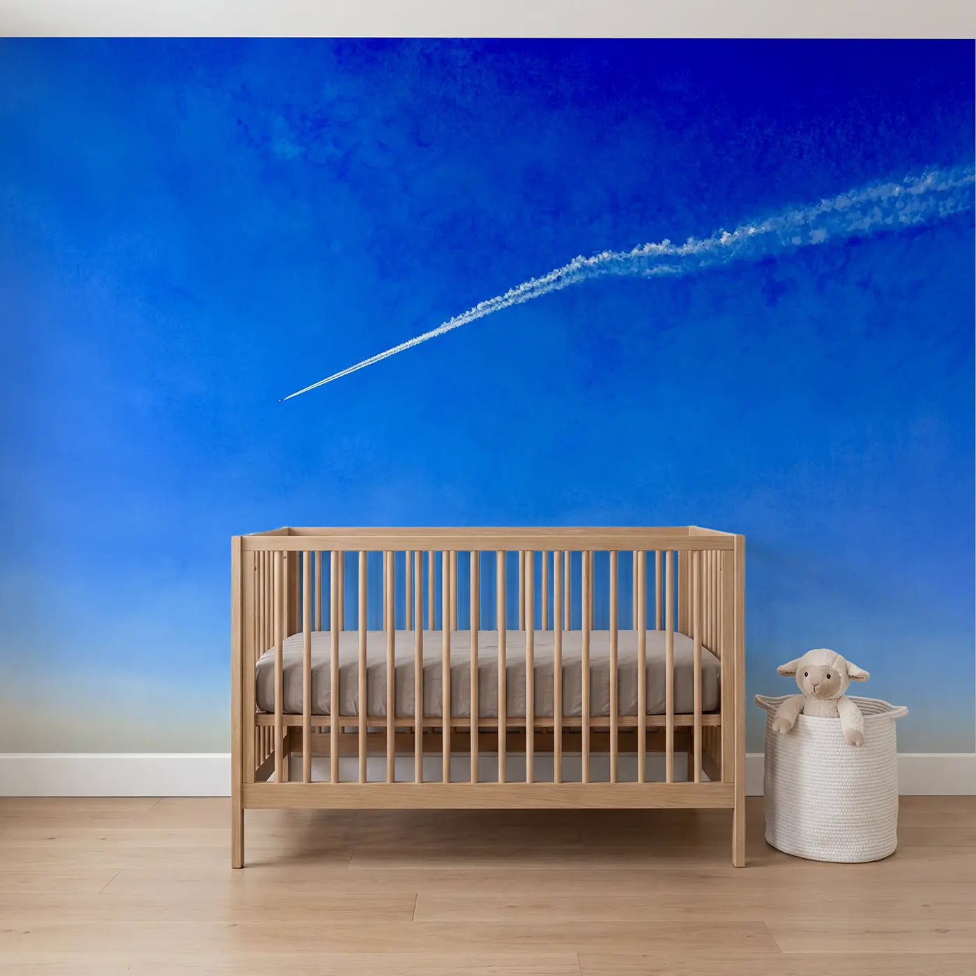 Watercolor lone contrail blue sky clouds wallpaper mural for nursery by Whimsy Tots