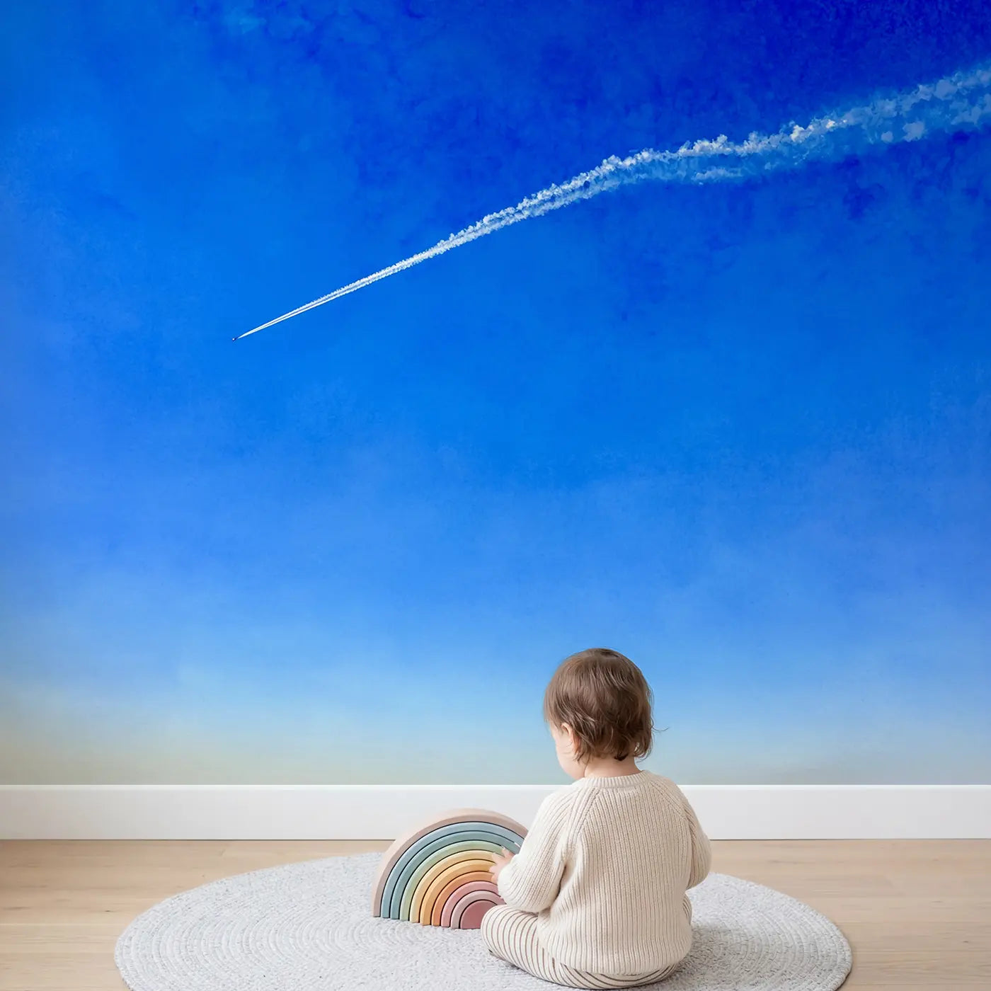 Child in nursery with Lone Contrail Blue Sky Wallpaper Mural by Whimsy Tots
