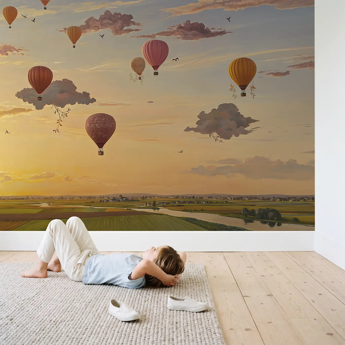 Child in nursery with Cloud Balloon Parade Wallpaper Mural by Whimsy Tots