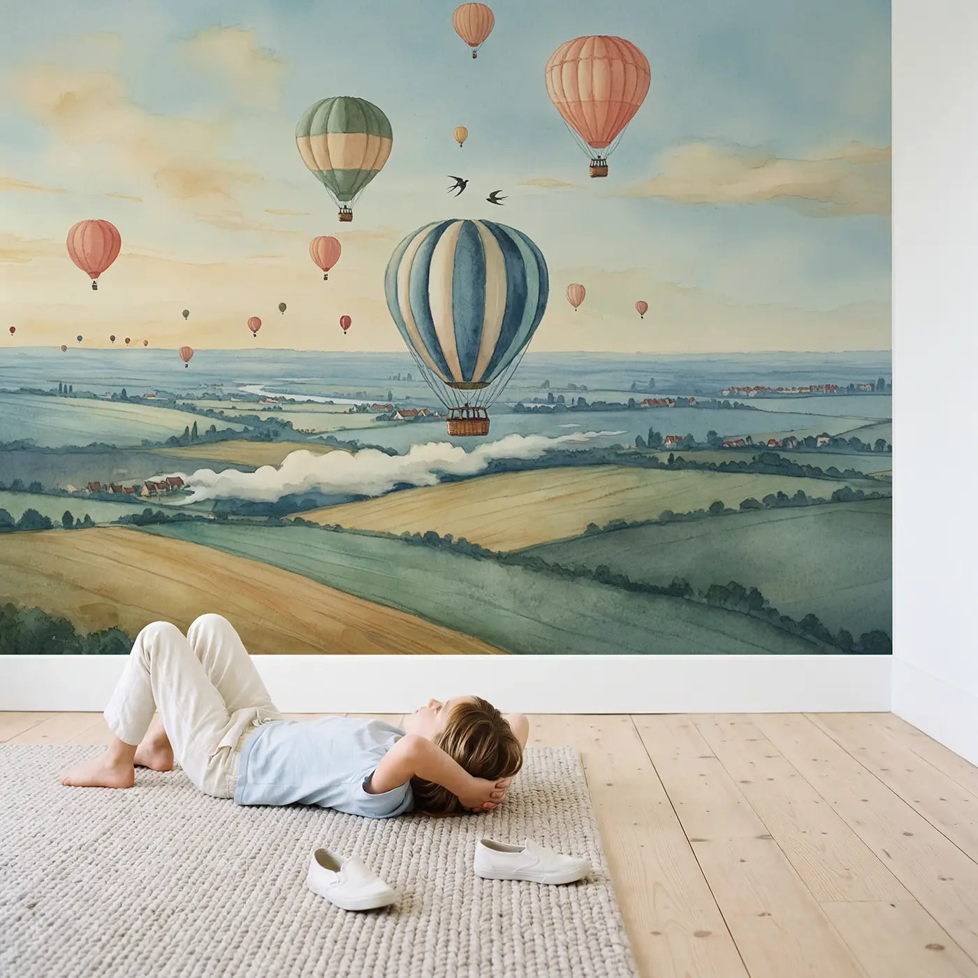 Child in nursery with Morning Balloon Skyscape Wallpaper Mural by Whimsy Tots