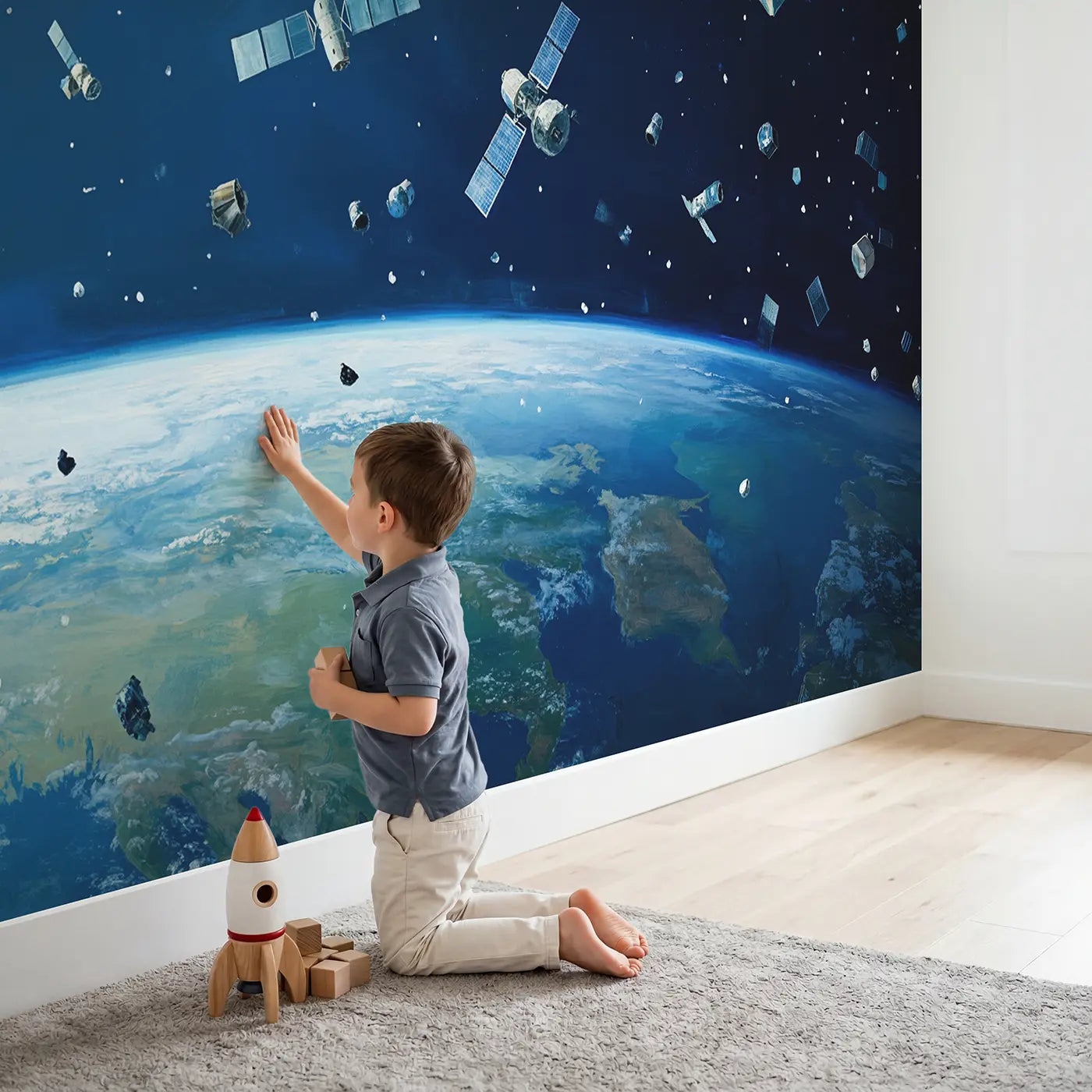 Child in nursery with Floating Satellites Over Earth Wallpaper Mural by Whimsy Tots