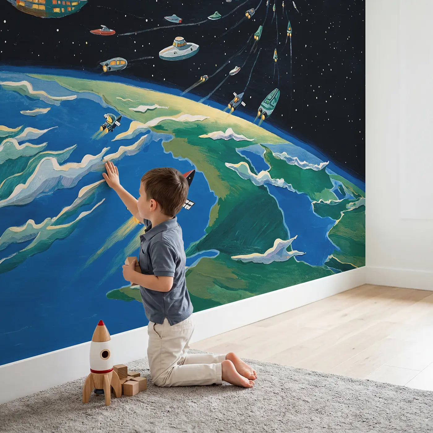 Child in nursery with Spaceship Fleet Earth Departure Wallpaper Mural by Whimsy Tots