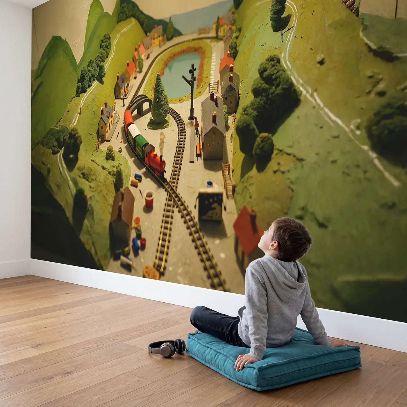 Child in nursery with Miniature Train World Wallpaper Mural by Whimsy Tots