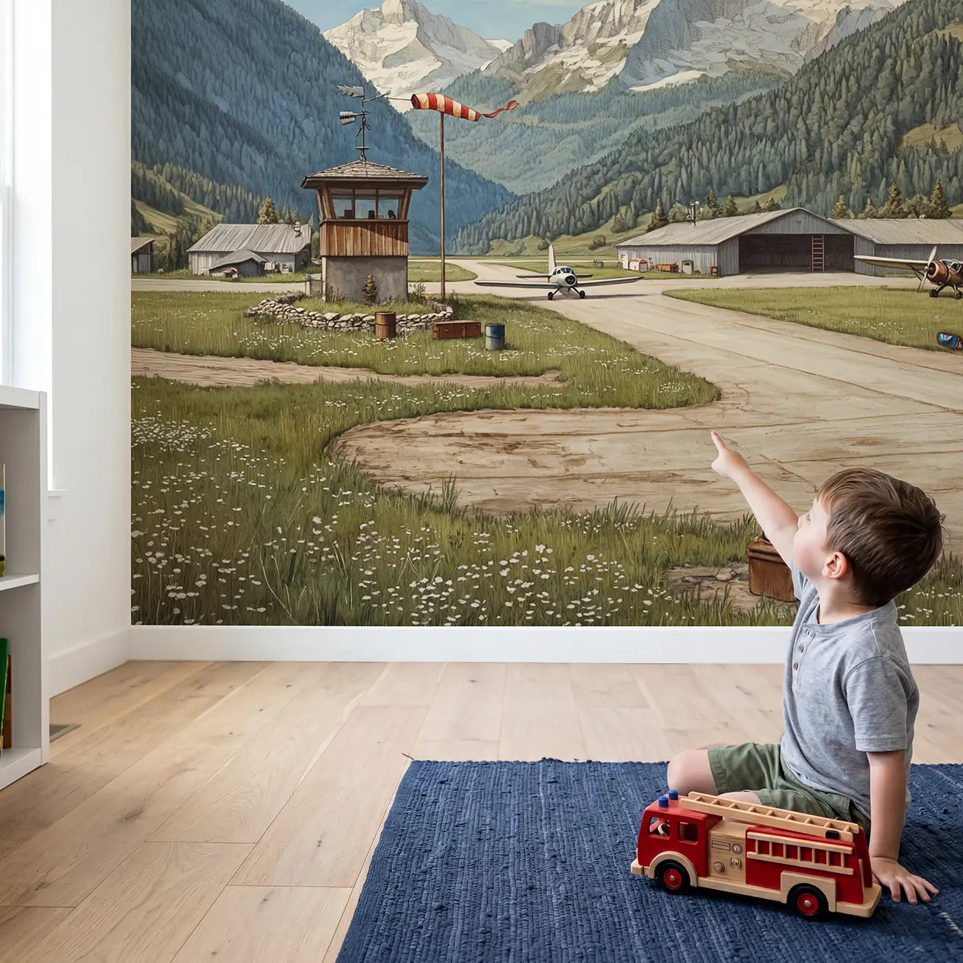 Child in nursery with Mountain Airfield Morning Wallpaper Mural by Whimsy Tots