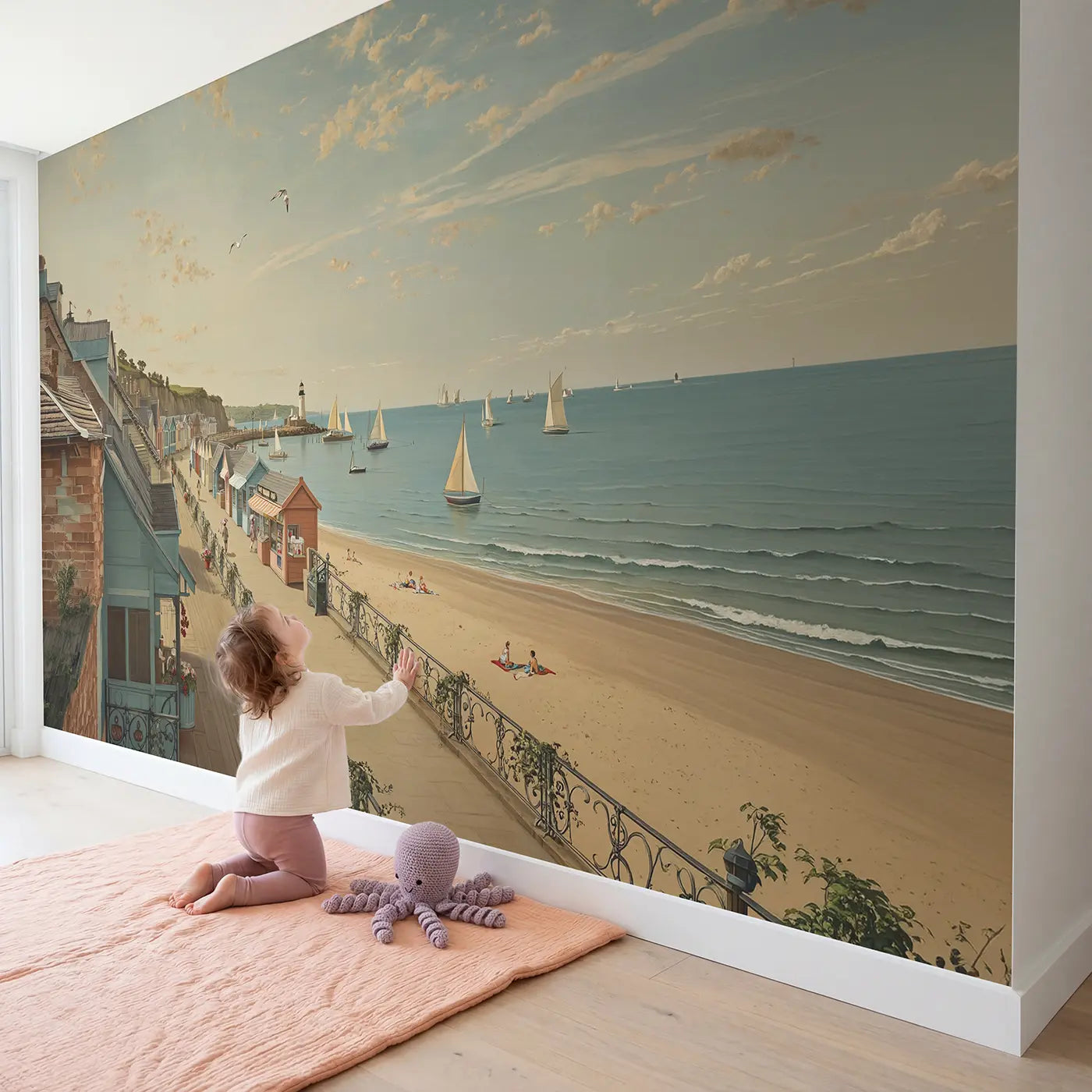 Child in nursery with Seaside Boardwalk Town Wallpaper Mural by Whimsy Tots