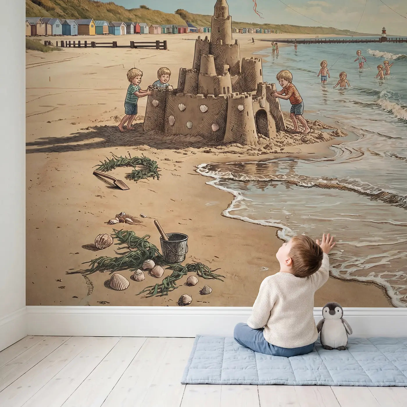 Child in nursery with Sandcastle and Tide Beach Wallpaper Mural by Whimsy Tots