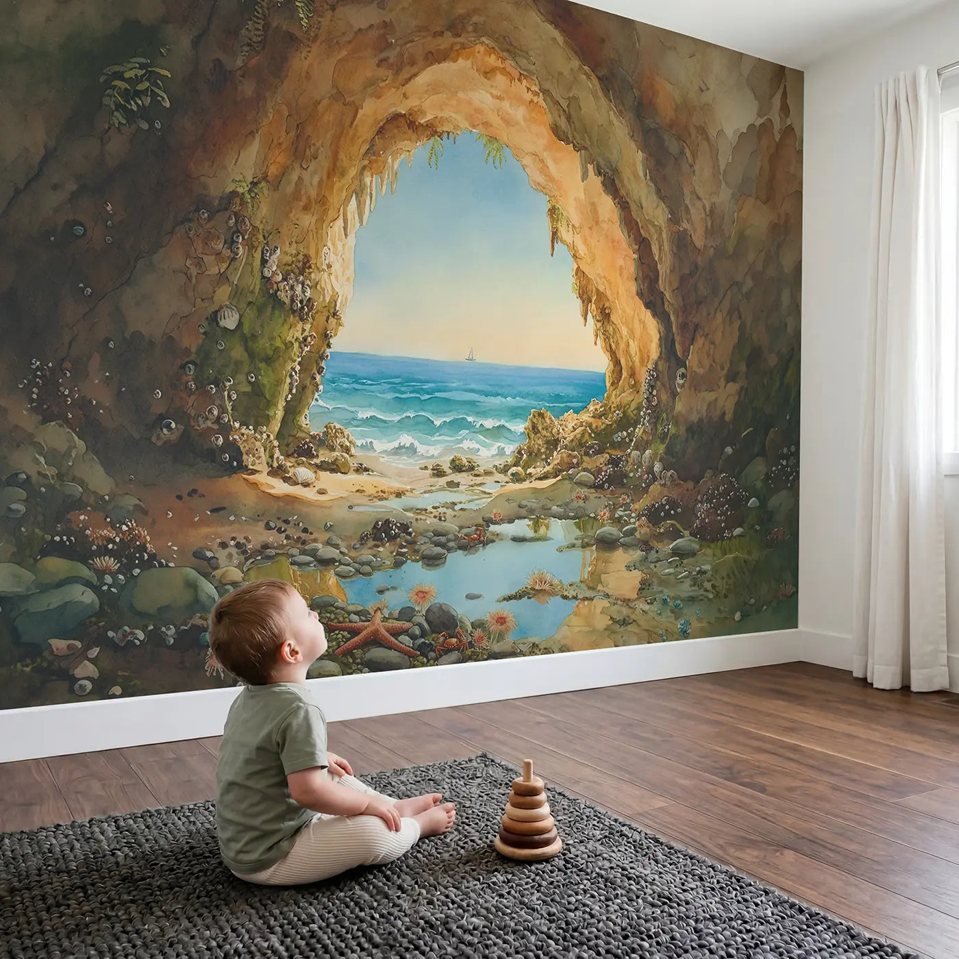 Child in nursery with Seaside Cave Ocean View Wallpaper Mural by Whimsy Tots