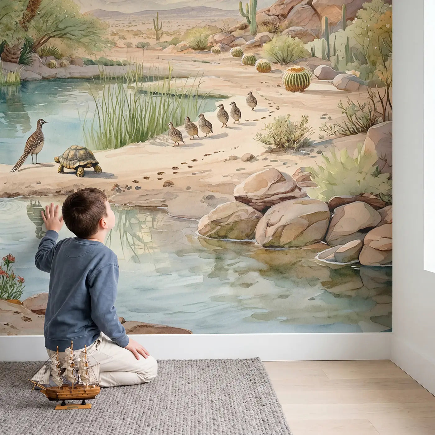 Child in nursery with Desert Oasis Wildlife Wallpaper Mural by Whimsy Tots