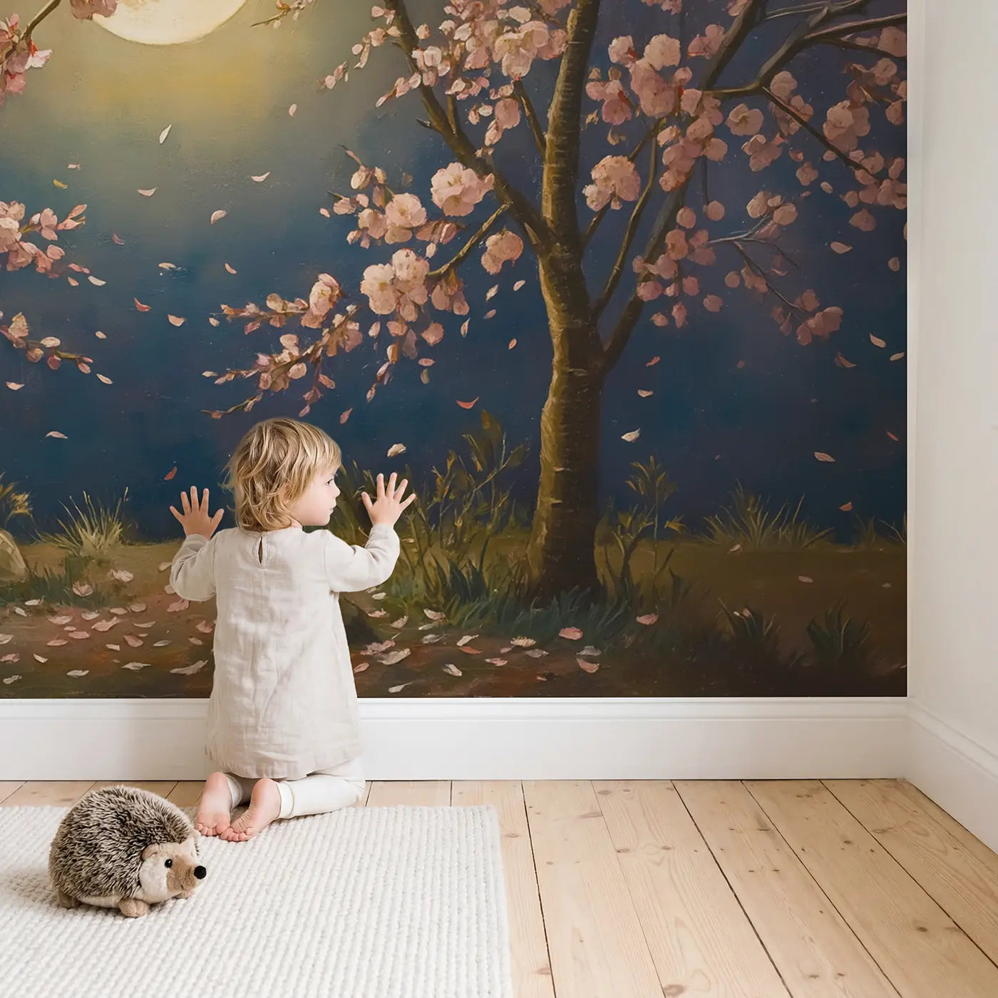 Child in nursery with Moonlit Cherry Blossom Wallpaper Mural by Whimsy Tots
