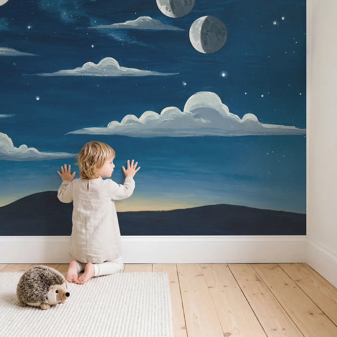 Child in nursery with Moon Phase Night Arc Wallpaper Mural by Whimsy Tots