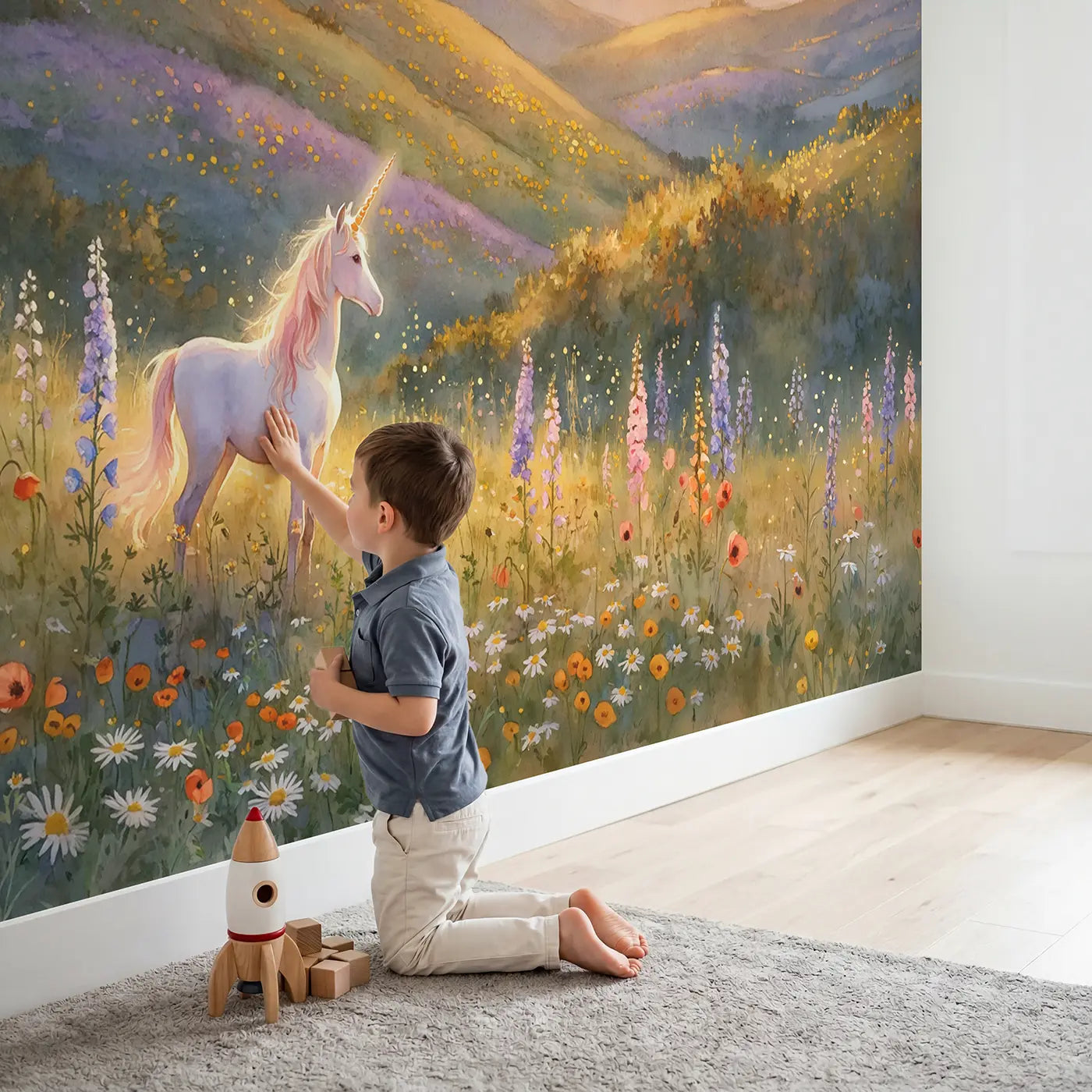 Child in nursery with Golden Meadow Unicorn Wallpaper Mural by Whimsy Tots