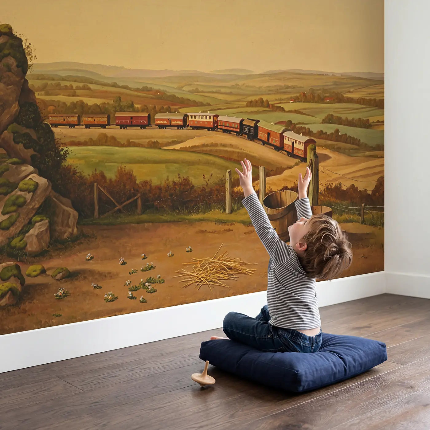 Child in nursery with Circus Train Winding Countryside Wallpaper Mural by Whimsy Tots