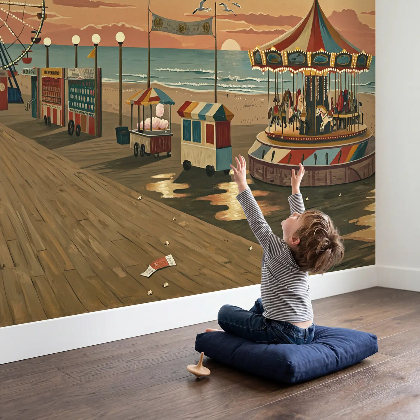 Child in nursery with Vintage Coastal Carnival Wallpaper Mural by Whimsy Tots
