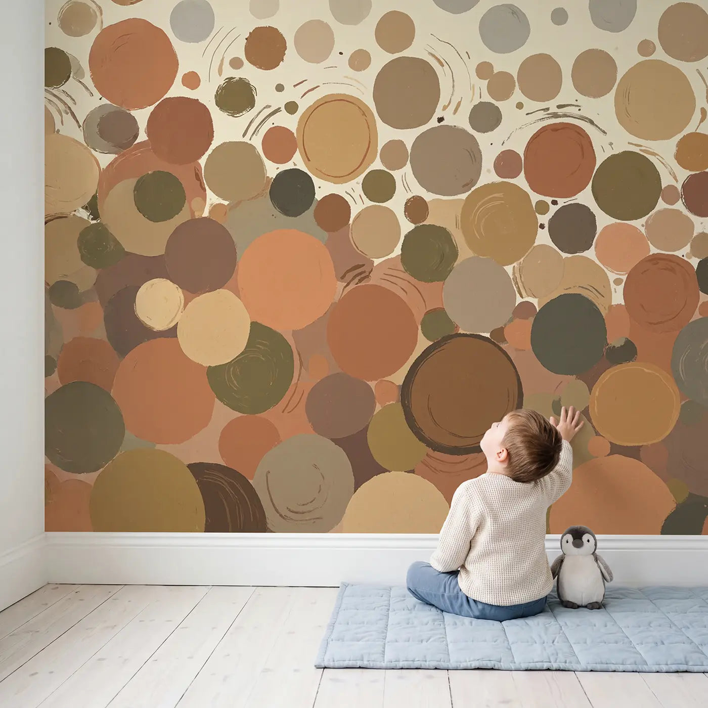 Child in nursery with Wabi Sabi Earth Circle Abstract Wallpaper Mural by Whimsy Tots
