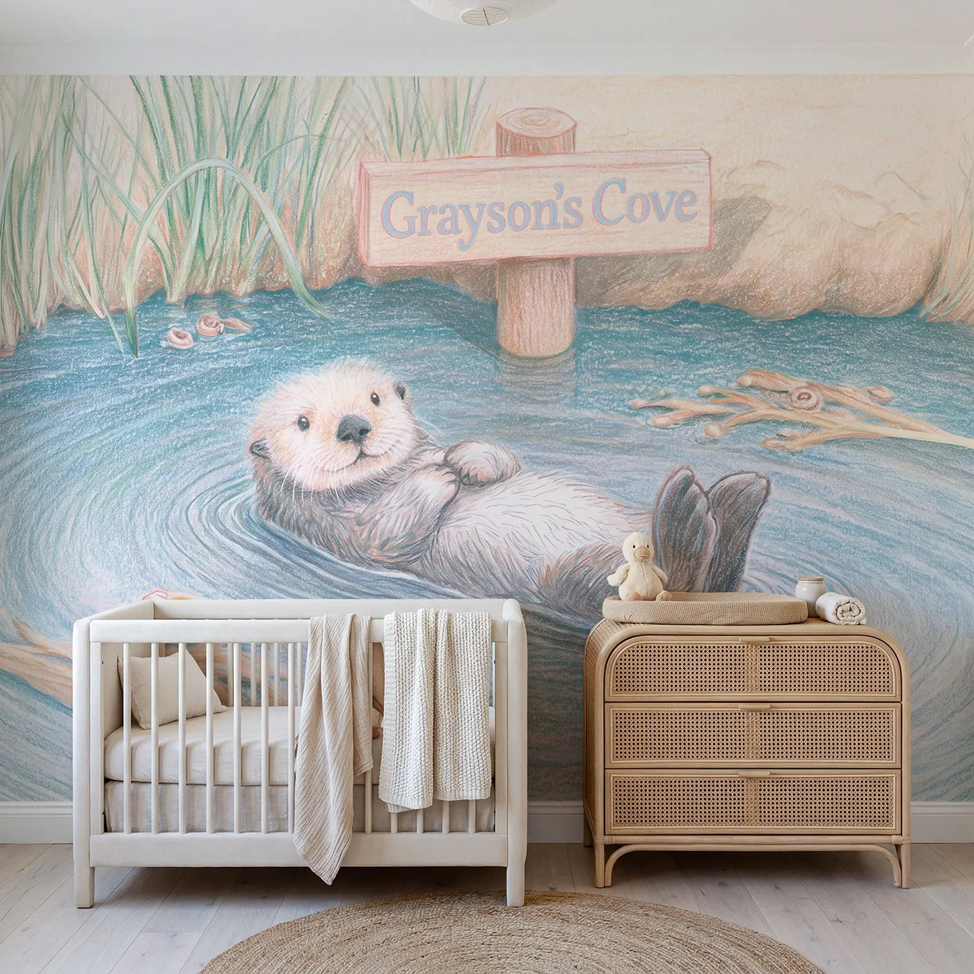 Colored pencil sea otter personalized wall mural with cove name sign for toddler room by Whimsy Tots