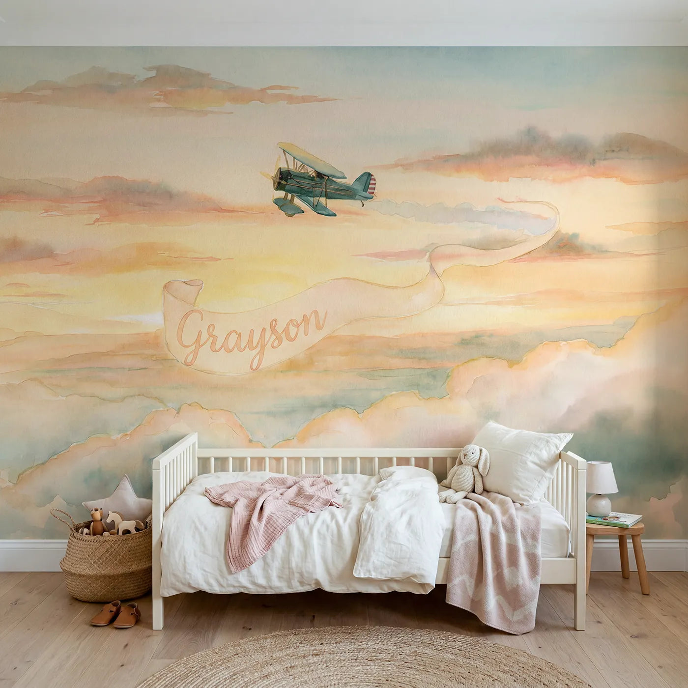 Watercolor sunset plane personalized wall mural with name banner for a toddler room by Whimsy Tots