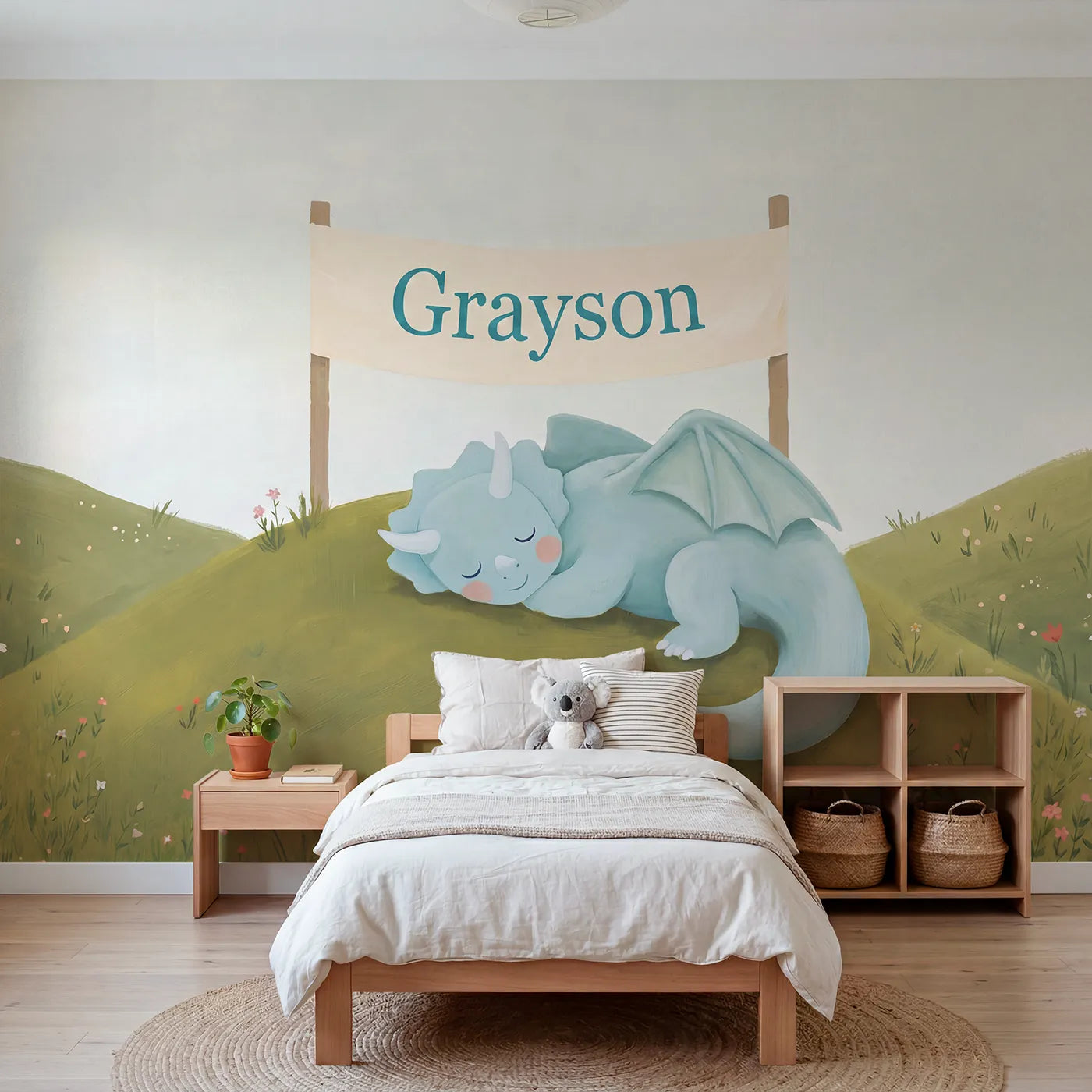 Modern illustration dragon on a hill with a name banner, playroom mural by Whimsy Tots