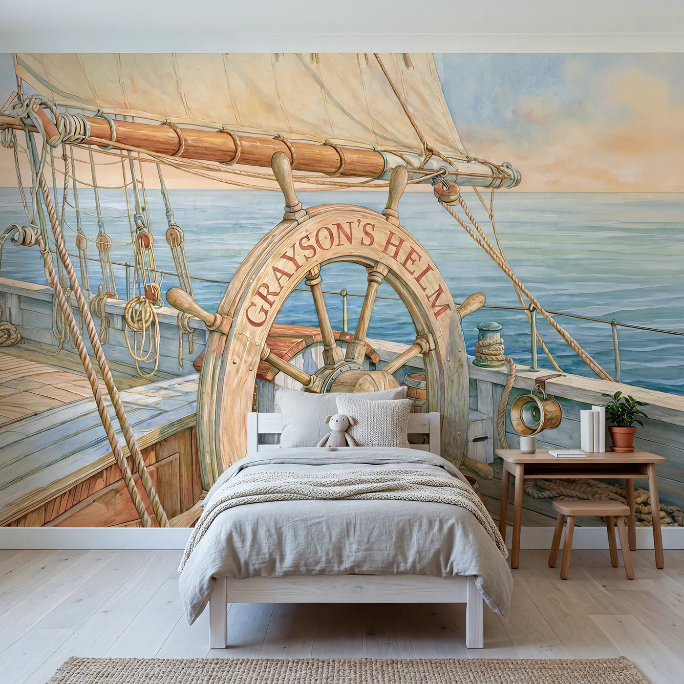 Storybook ships wheel on a deck with a name on the hub, big-kid bedroom mural by Whimsy Tots