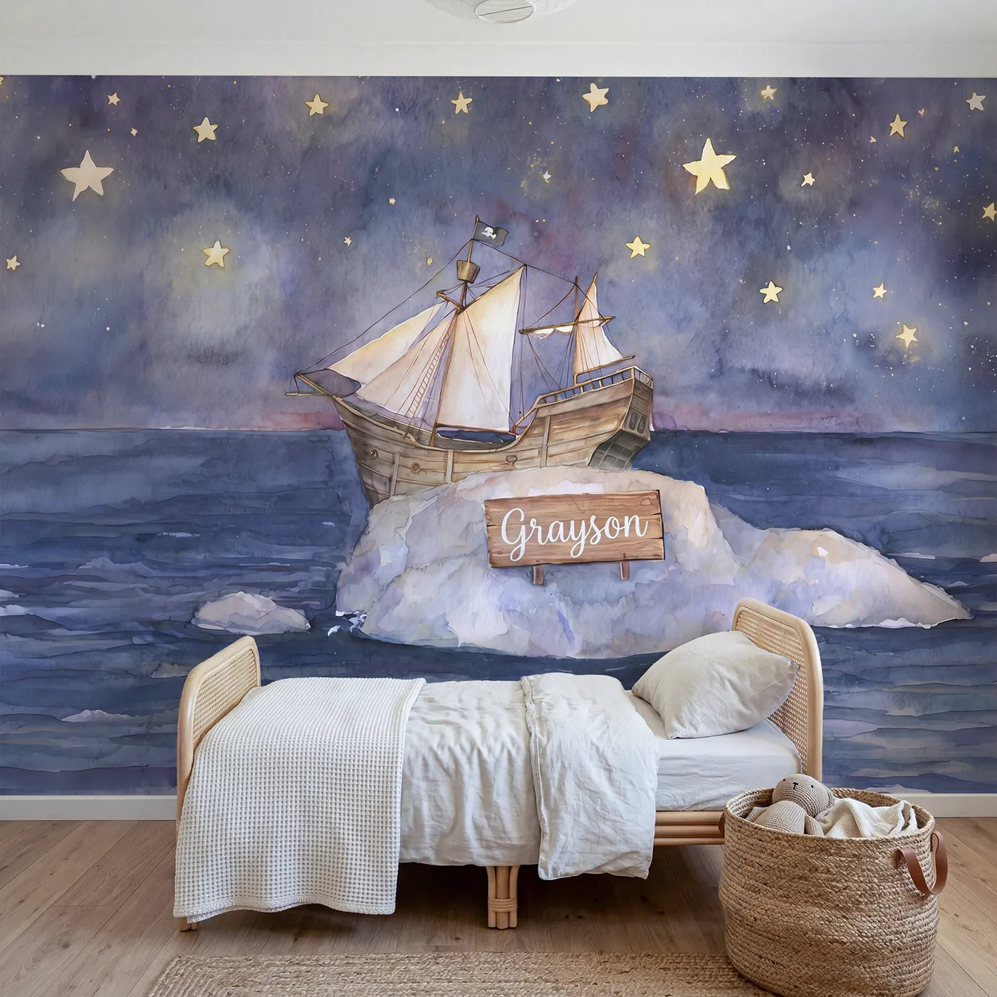 Watercolor pirate ship under stars with a name on a rock, playroom mural by Whimsy Tots