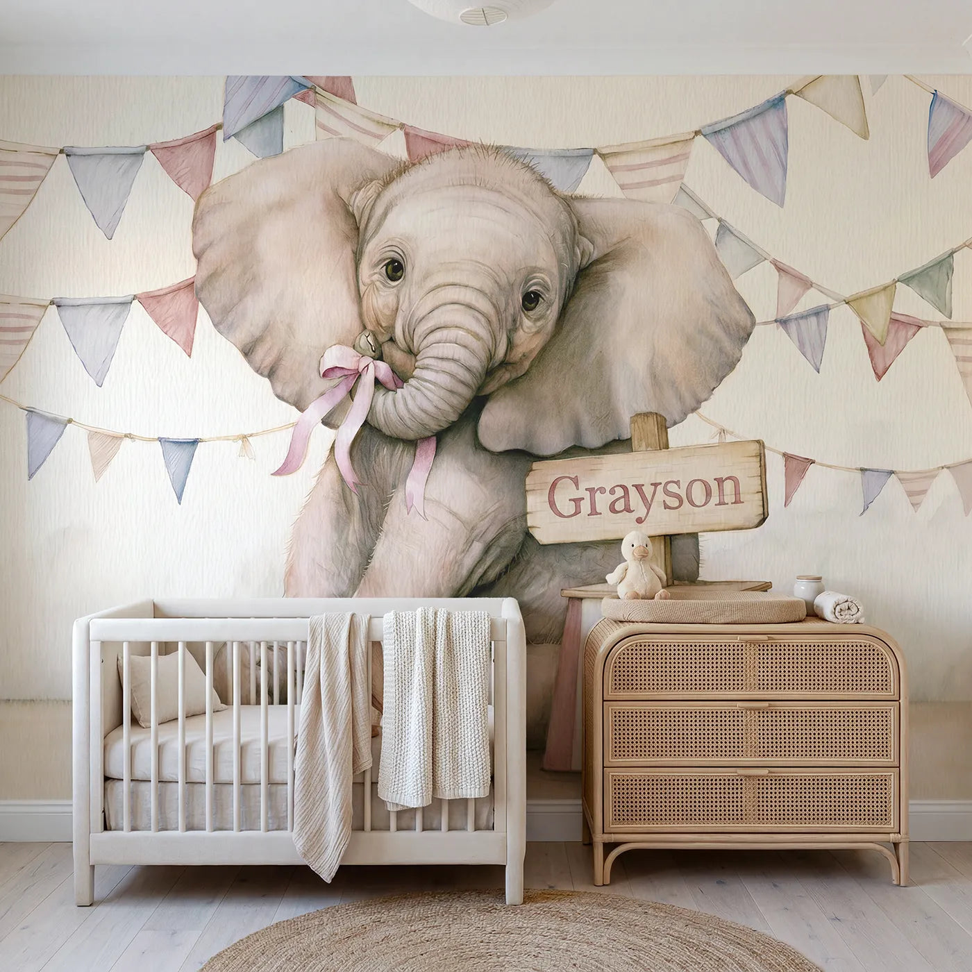 Colored pencil baby elephant with a ribbon and podium name sign, nursery mural by Whimsy Tots