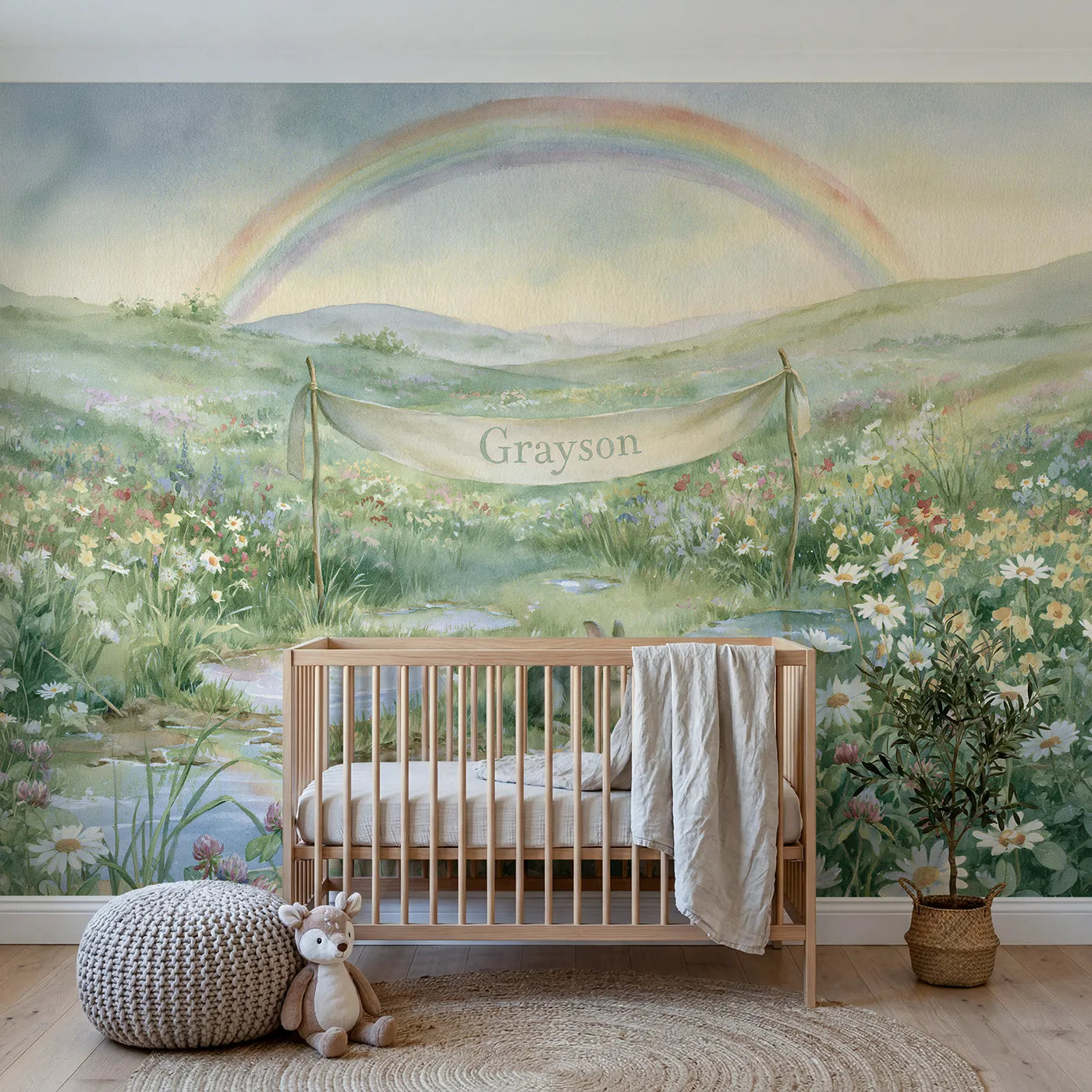 Storybook rainbow meadow personalized wall mural with lettered cloth banner between posts by Whimsy Tots