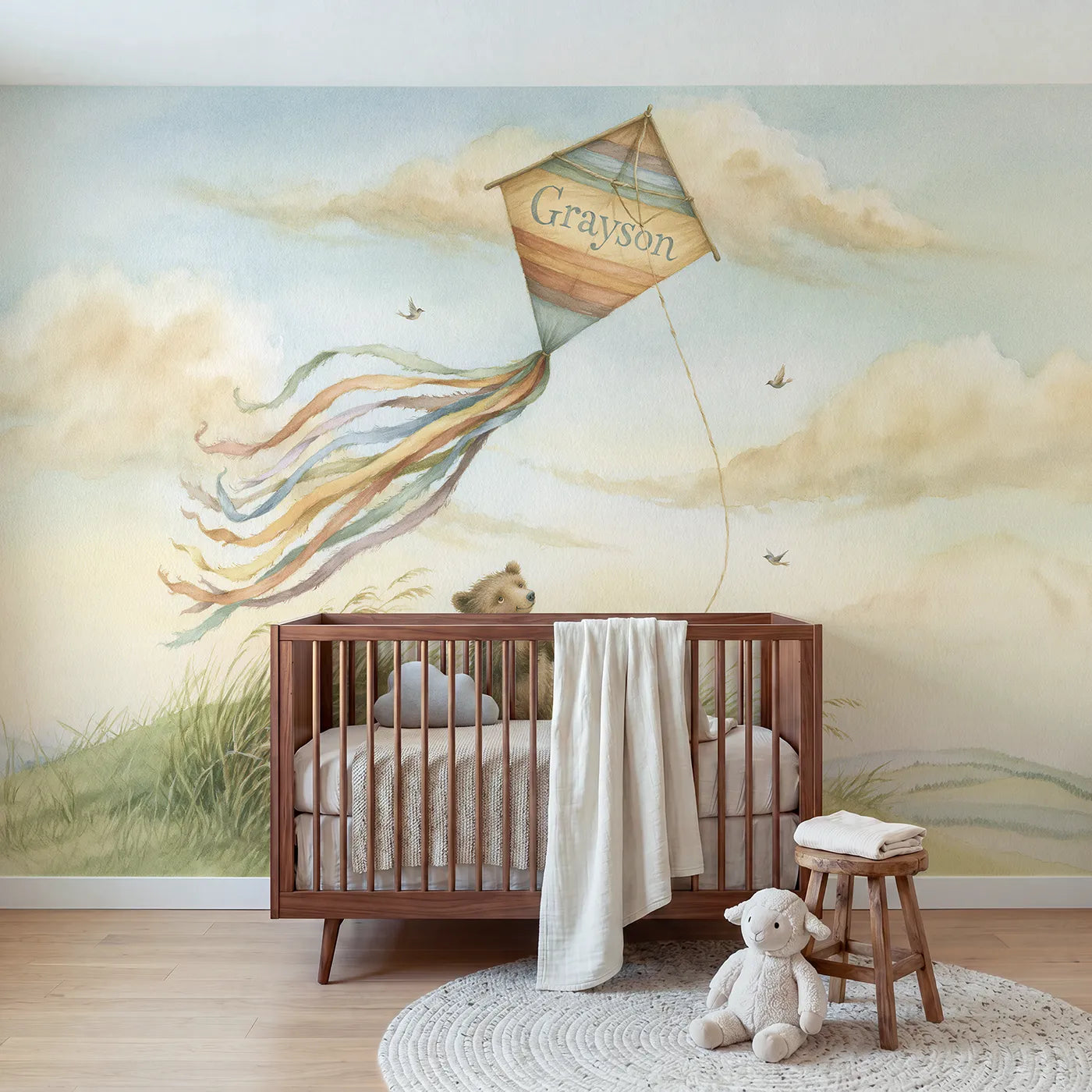 Storybook rainbow kite personalized wall mural with a painted name across its face by Whimsy Tots