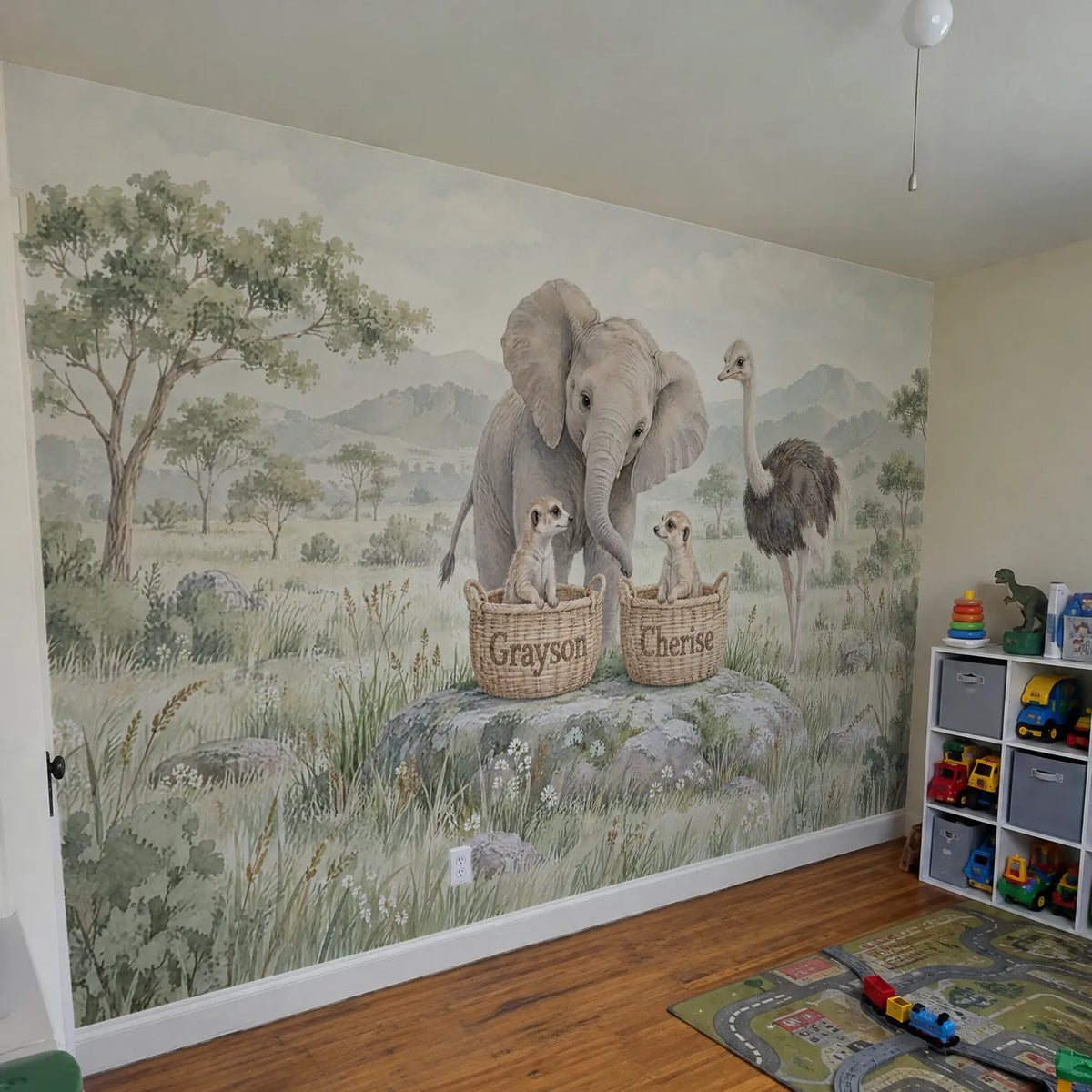 Watercolor personalized wall mural of two meerkats in name baskets, in a room photo, by Whimsy Tots