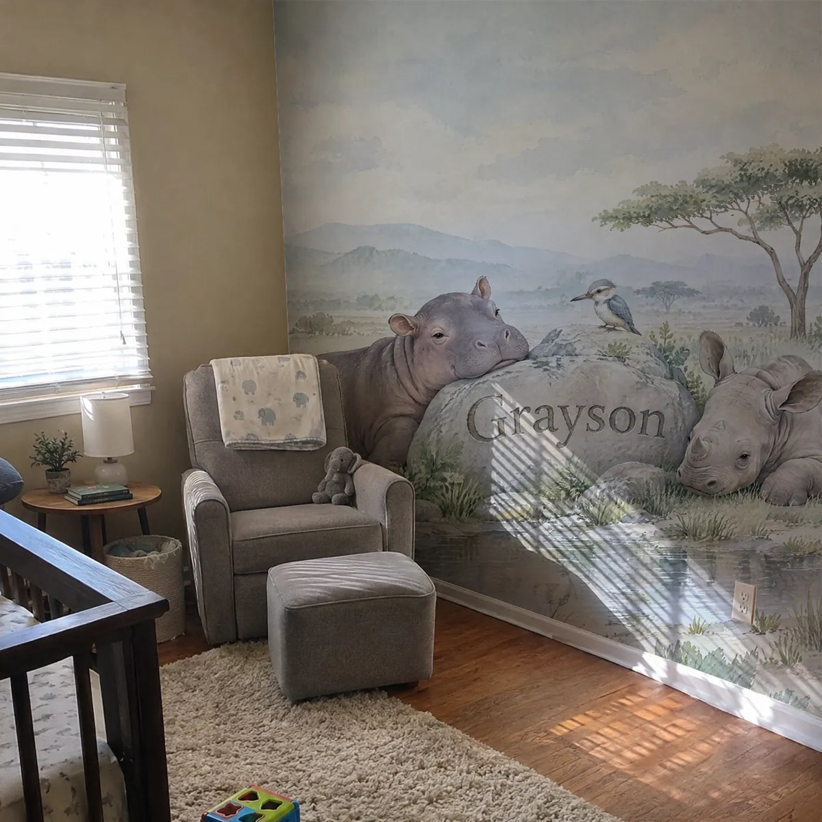 Watercolor personalized wall mural of a hippo and rhino by a name stone, in a room photo, by Whimsy Tots