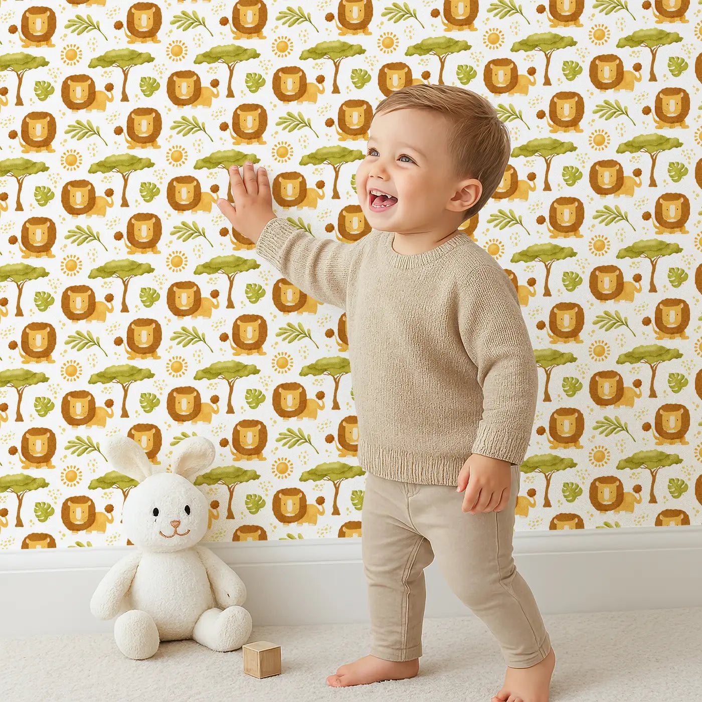 Child in front of Whimsy Tots Safari Lion Haven Wallpaper with lion, tree, sun, leaf in design.