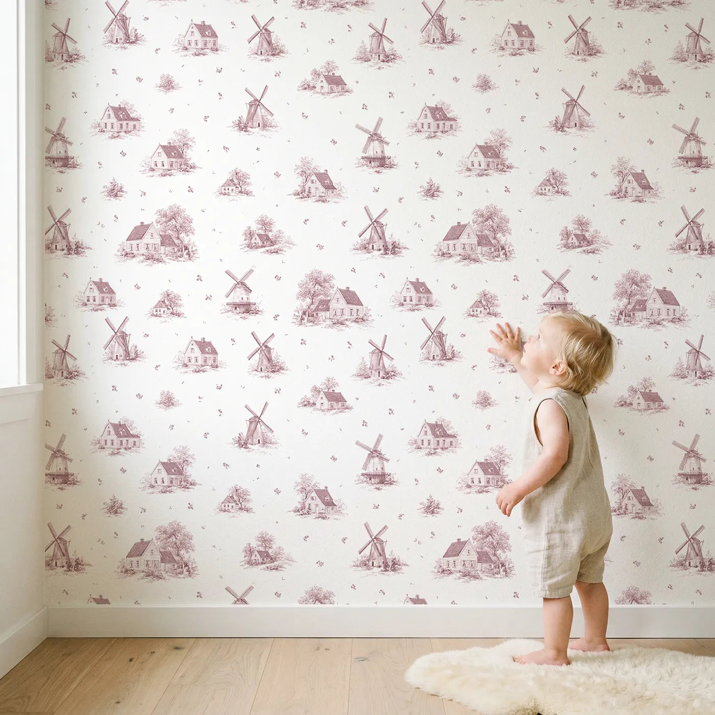 Windmill Toile Toss in Pink wallpaper in a cozy kids room - Whimsy Tots