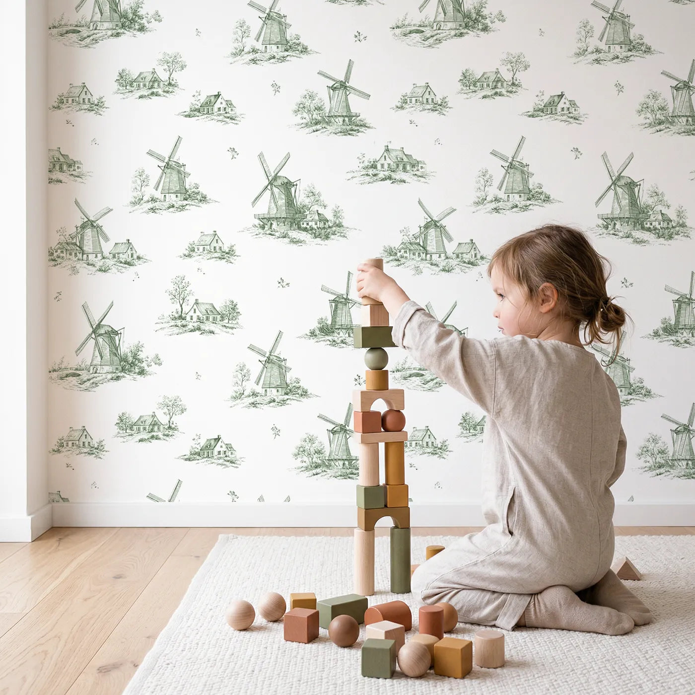 Windmill Toile Rows in Green wallpaper in a cozy kids room - Whimsy Tots